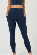 Legging gainant taille haute à poches pleine longueur